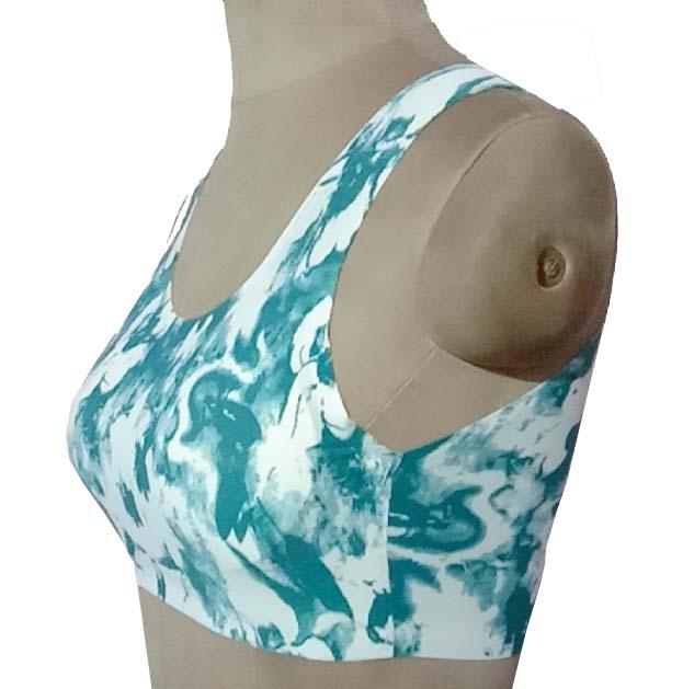 Teal and white tie-dye sports bra with racerback design, displayed on mannequin