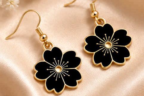 Black flower drop earrings with gold accents, elegant women's fashion jewelry
