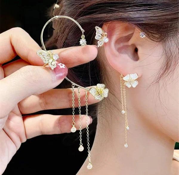 Elegant butterfly and flower drop earrings with crystal details, perfect for women's fashion accessories.